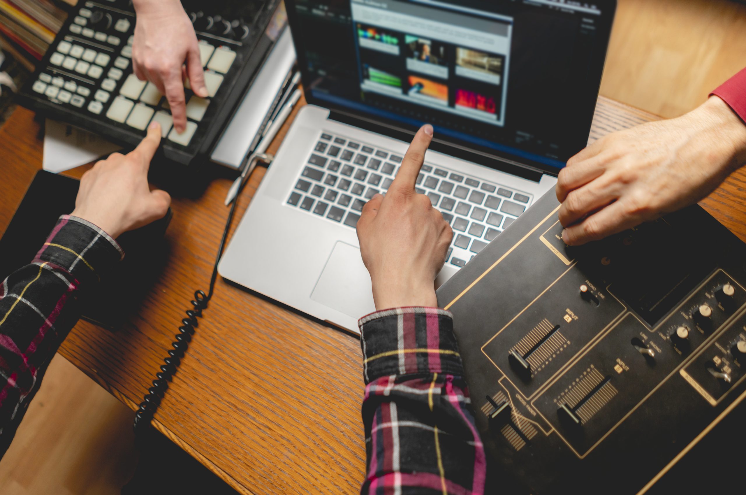 group of people working in sound recording studio or label